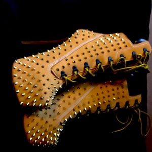 Gold studded high heeled boots